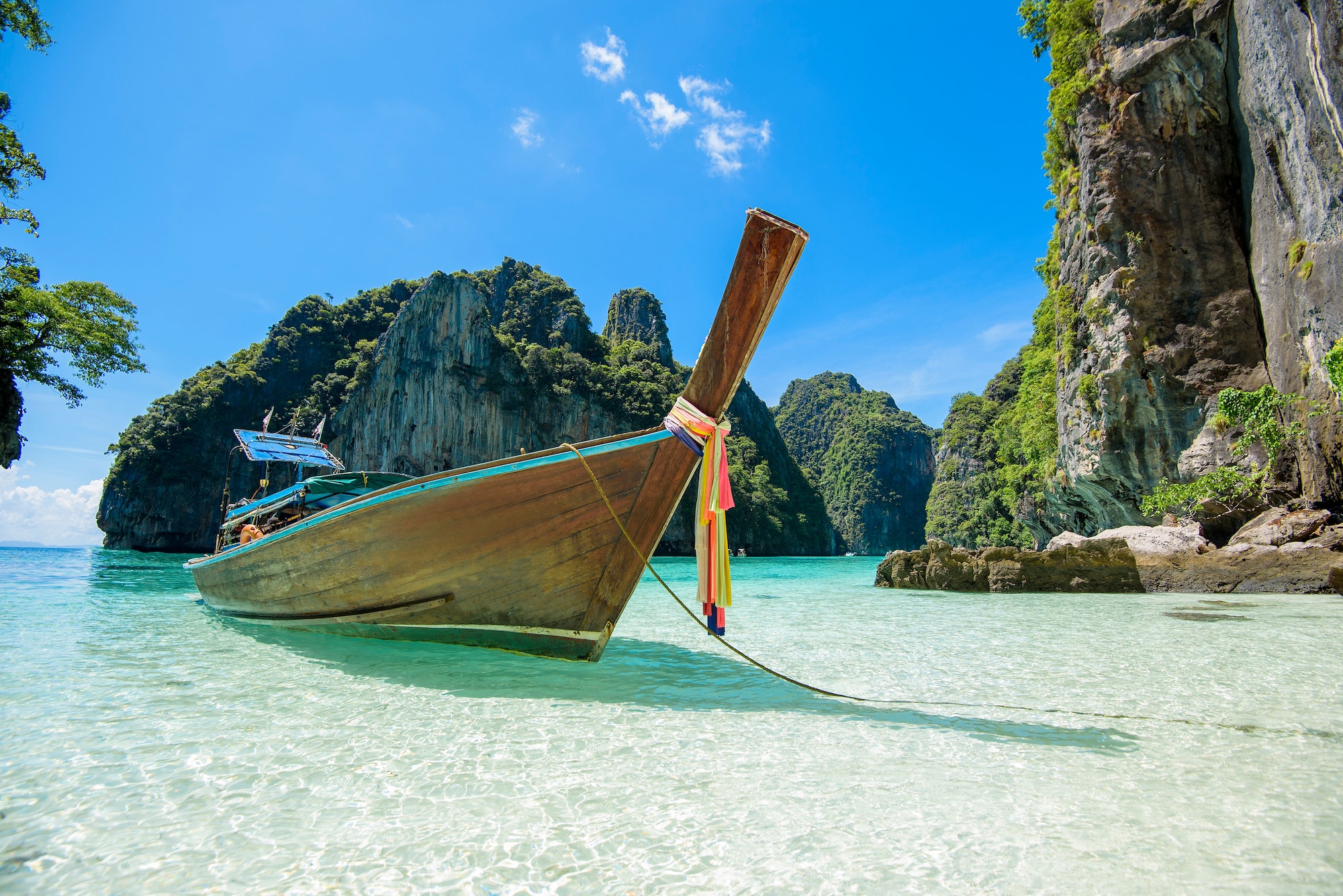 view-of-thai-traditional-longtail-boat-over-clear-sea-and-sky-in-the-sunny-day.jpg